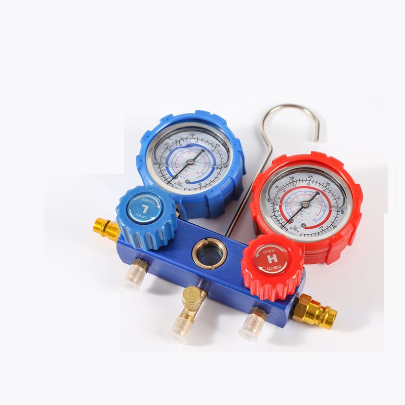 HVAC manifold gauge valves with dual gauges (red and blue), optional charging hoses