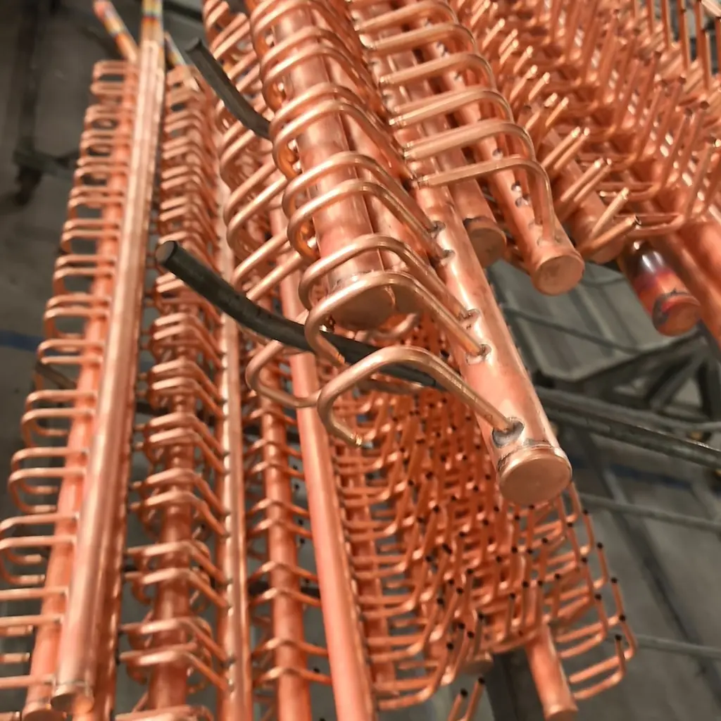 custom copper header manifold with multi-circuit branch tubes for HVAC coils
