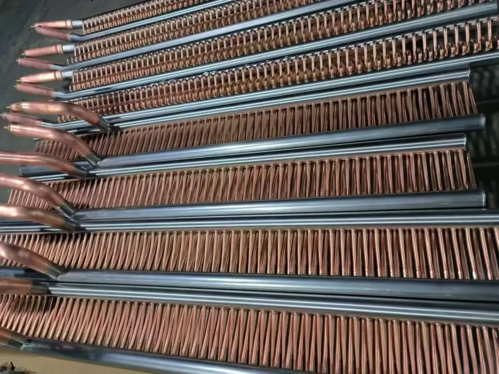 Custom stainless steel and copper composite header manifold for high-pressure CO2 heat pump systems