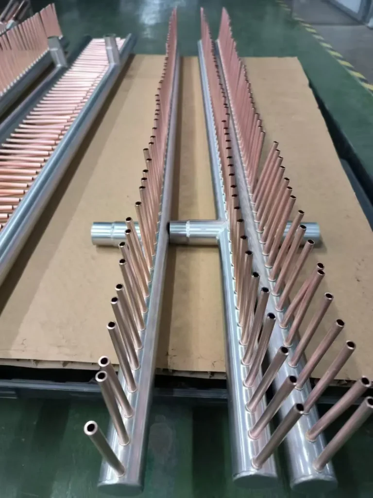 Stainless steel main body header with brazed copper branch tubes for HVAC heat exchanger manifolds
